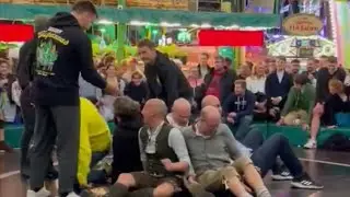 Oktoberfest 2022 Teufelsrad Rodeo Devil's Wheel and guys with bald head