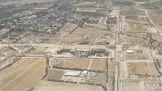 Landing Over New Tashkent &ndash; Aerial View from Airplane Window Seat