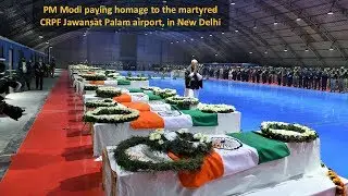PM Modi paying homage to the martyred CRPF Jawans, at Palam airport, in New Delhi