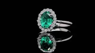 Emerald and Diamond Halo Ring in 18K White Gold - Orogem Jewelers