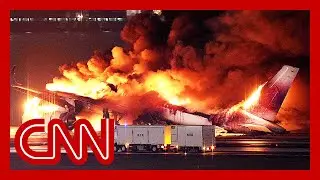 Fully booked flight burst into flames after landing in Tokyo