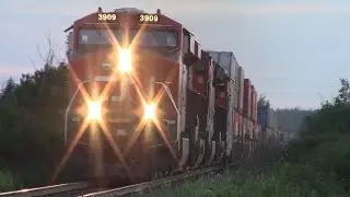 Long Stack Train CN 120 w/Track Inspection Car passing thru Nappan, NS at Track Speed during Sunrise
