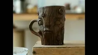 Painting ceramic mug with underglazes.