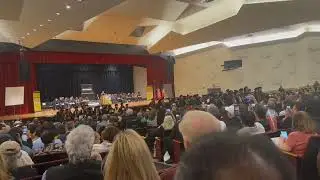Mayor Eric Adams, NYC, is booed and students turn their back on him, during his City University of