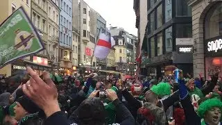 Switzerland v Northern Ireland - Northern Ireland Fans Cheer In The Pouring Rain