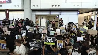 Hong Kong protesters rally at airport to 'educate' visitors | AFP