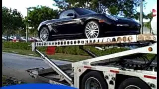 BMW and Porsche are Loaded on to Car Transport Carrier