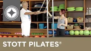 STOTT PILATES® for Active Aging | Trap Strengthener with Roll Down Bar on the Cadillac