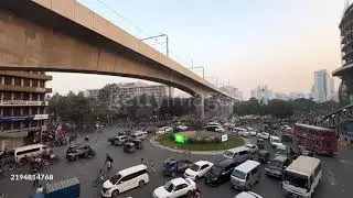 4K Timelapse of Dhaka City Traffic at Busy Intersection with Metro Rail in View.