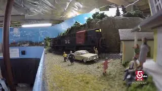 An elaborate scale model railroad layout chugs its engine in a Leominster, Mass. home