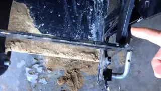 John Deere X500 front quick hitch hits front weight bracket.