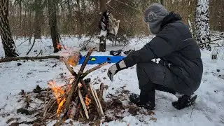 survival in the forest in winter preparing dinner