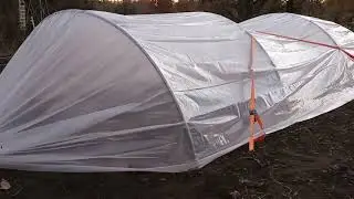 Holding down greenhouse plastic in the wind on low tunnels | Ratchet Strap Method