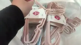 Organize your clothes using 50 hangers for $4 and a clothes drying rack for $2 50