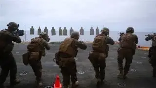 Marines on shooting range aircraft elevator aboard USS Bataan (LHD 5)