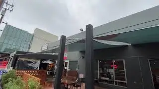 Rain proof sail shades for a restaurant patio.