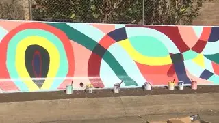 Students paint traffic safety murals along Kamehameha Highway