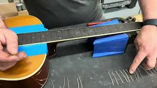 Preparing frets for a Taylor GS with binding.