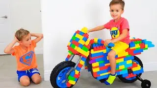 Влад и Ники катаются на игрушечном спортивном мотоцикле и играют с игрушками