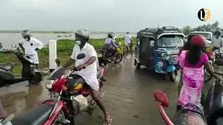 Floods in Amparai: The road from Galoya settlements to Kalmunai submerged