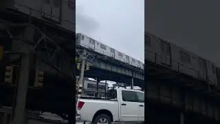 D train on a sharp curve at 25th Av