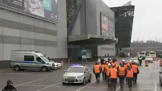 Emergency workers arrive at destroyed Moscow concert hall