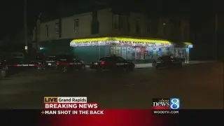 Shot man walks into GR party store