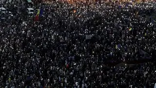 Thousands rally in Bucharest on anniversary of violent protest