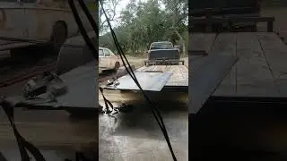 unloading metal plate from trailer into garage