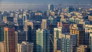 Skylines under the thick fog at the street timelapse of Abu Dhabi at morning