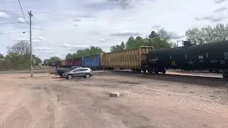 CN3097 GE ET44AC Tier 4 leads M347 through Junction City, Wi. Trailing Unit CN2898 GE ES44AC.