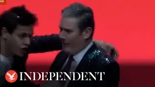 Keir Starmer showered in glitter by stage intruder during Labour conference speech