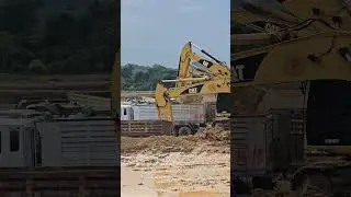 There are so many Cat excavators that my arms are about to get tangled up.