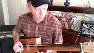 1 + 3 CBG! 3 string slide cigar box guitar with bass string by Nigel McTrustry