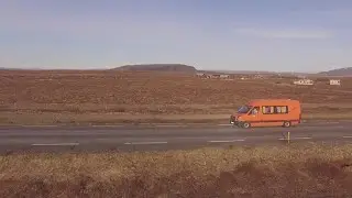Orange Van Cruising Iceland Road Stock Video