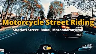 Riding a motorcycle in Shariati Street, Babol, Mazandaran, northern Iran