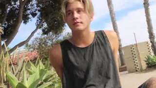 blonde skater takes off his shoes