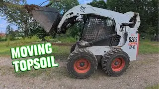 Moving Topsoil to Grade Out Hill Side Part 1