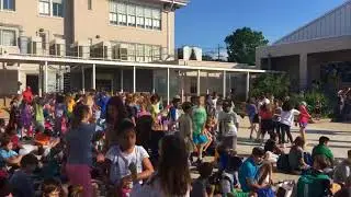 Lusher Charter kindergartners sing and dance to graduating seniors