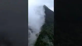 Spectacle of Rain Clouds Intercepted by Mountain Peaks on Yunnan Plateau, Southern China
