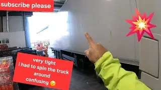 POV truck driving spinning the trailer to get into the bay Asda Supermarket