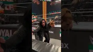 Rhea Ripley looks injury , asks a fan for help her