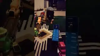 Choc playing with his trucks.