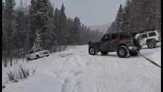 takes 3 jeeps to pull 1 toyota......