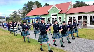 Ballater Pipe Band play Killiecrankie on march to  Pavilion eve 2025 Braemar Gathering in Scotland