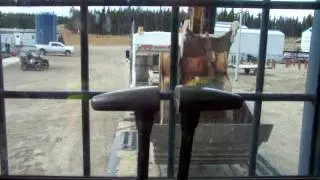 Loading 270 excavator on a beaver tail trailer.mov