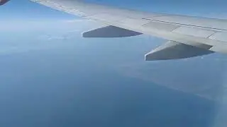 Clear sky. Good weather. Flight. View from the airplane window.