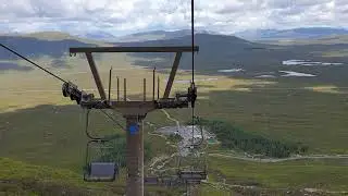 Glencoe Mountain resort chair lift going down with views of Rannoch Moor Scotland