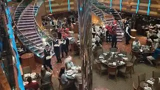 Fun dancing and singing on the last night onboard Carnival Magic MDR Maine dining room