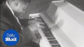 Fats Domino plays the piano in 1956 - Daily Mail